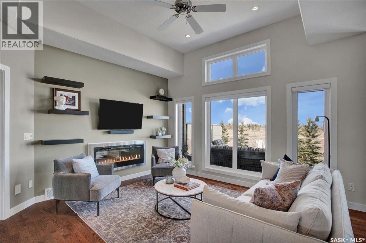 22 315 Ledingham Drive, Saskatoon, SK - Indoor Photo Showing Living Room With Fireplace