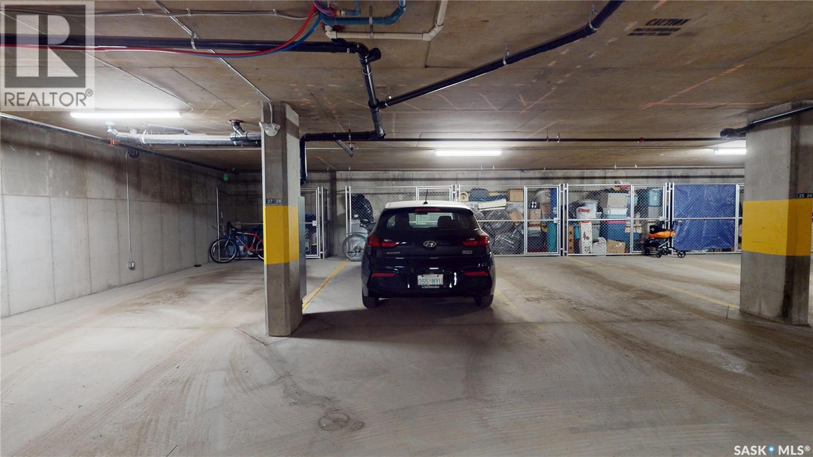 205 223 Evergreen Square, Saskatoon, SK - Indoor Photo Showing Garage
