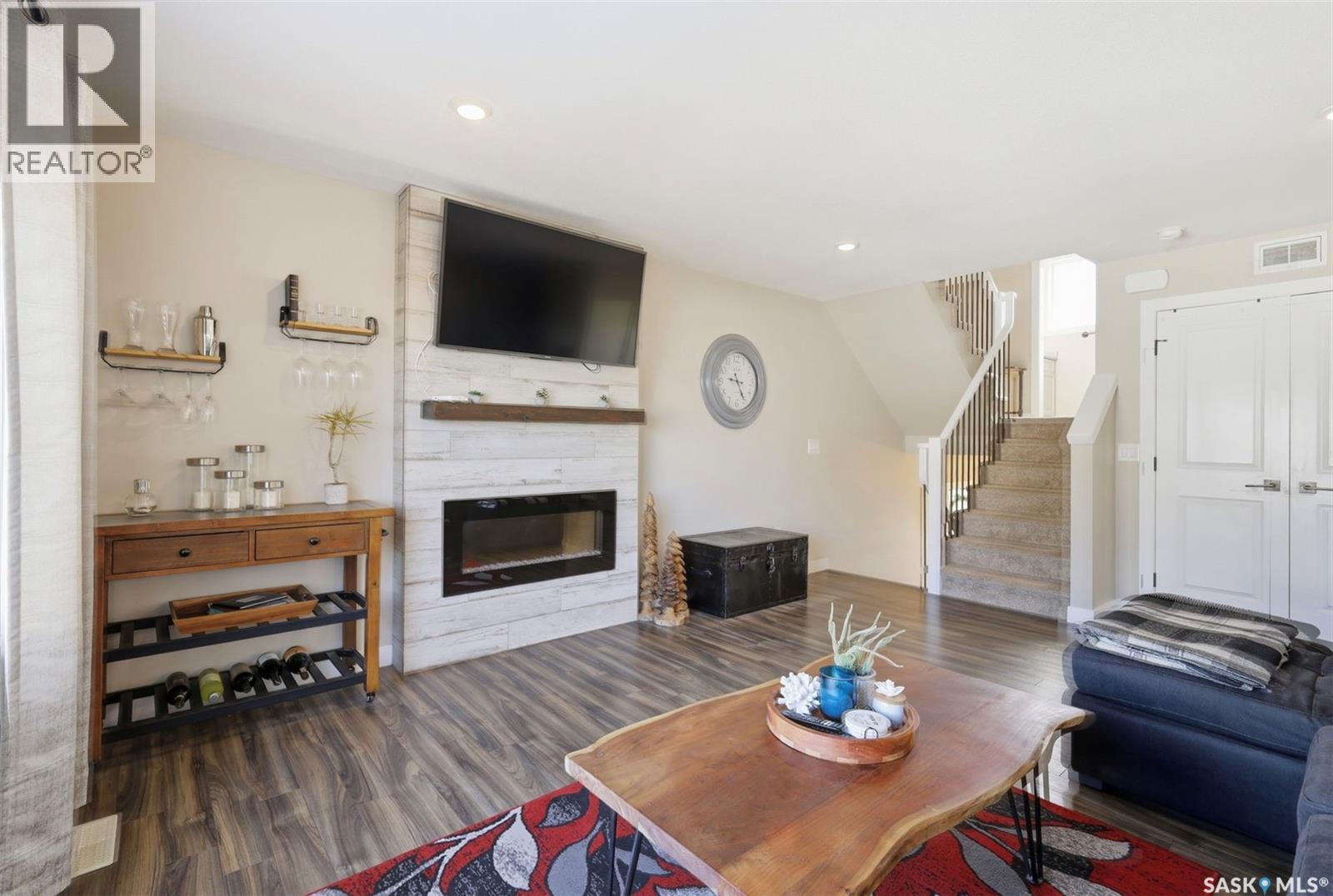 1047 Kolynchuk Crescent, Saskatoon, SK - Indoor Photo Showing Living Room With Fireplace