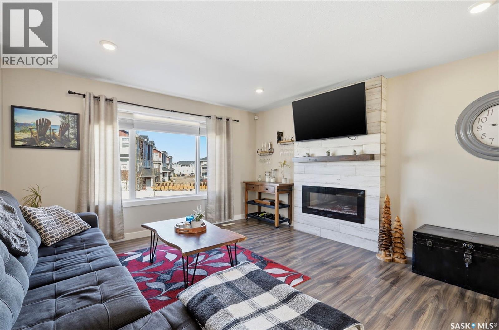 1047 Kolynchuk Crescent, Saskatoon, SK - Indoor Photo Showing Living Room With Fireplace