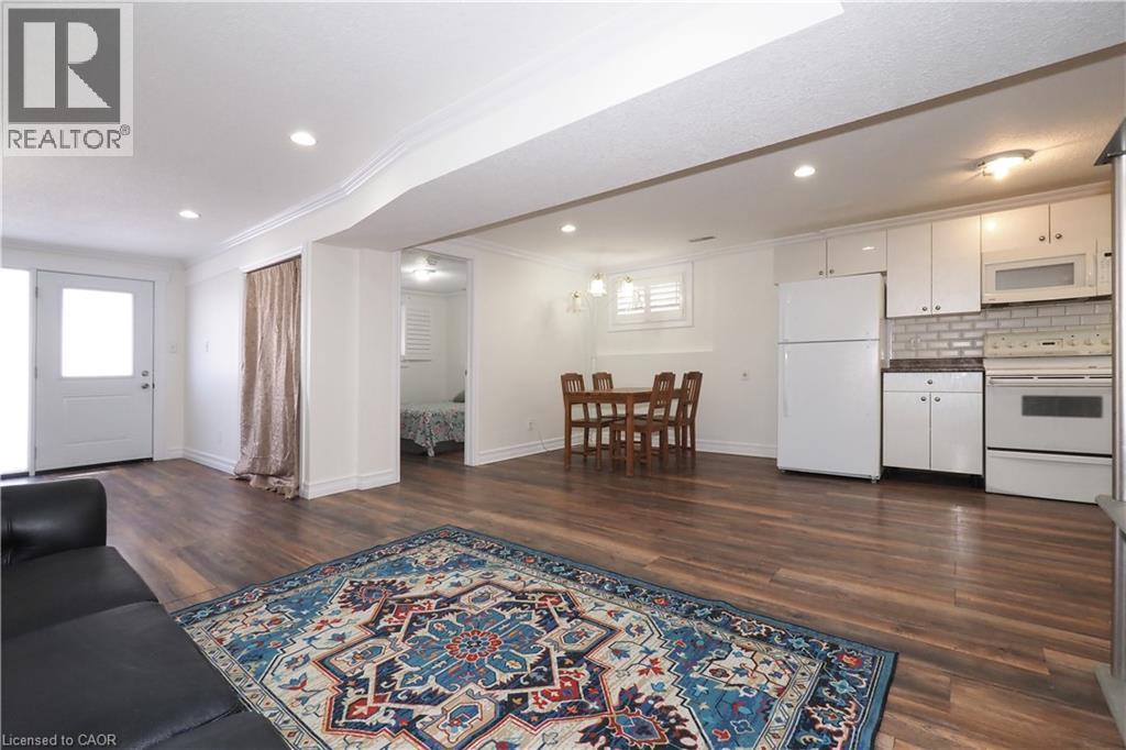 Open-concept living space featuring wood-finish flooring, recessed lighting, and white trim - 67 Hollyridge Crescent Unit# Lower, Kitchener, ON - Indoor