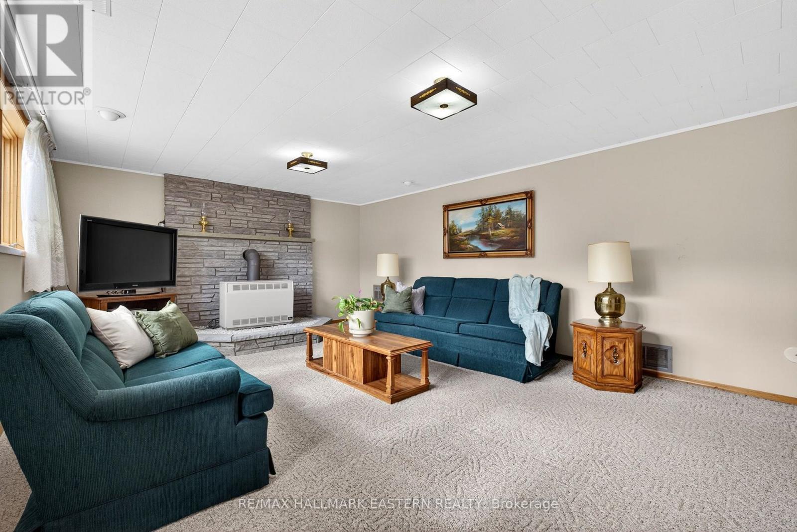 147 Second Line, Douro-Dummer, ON - Indoor Photo Showing Living Room With Fireplace