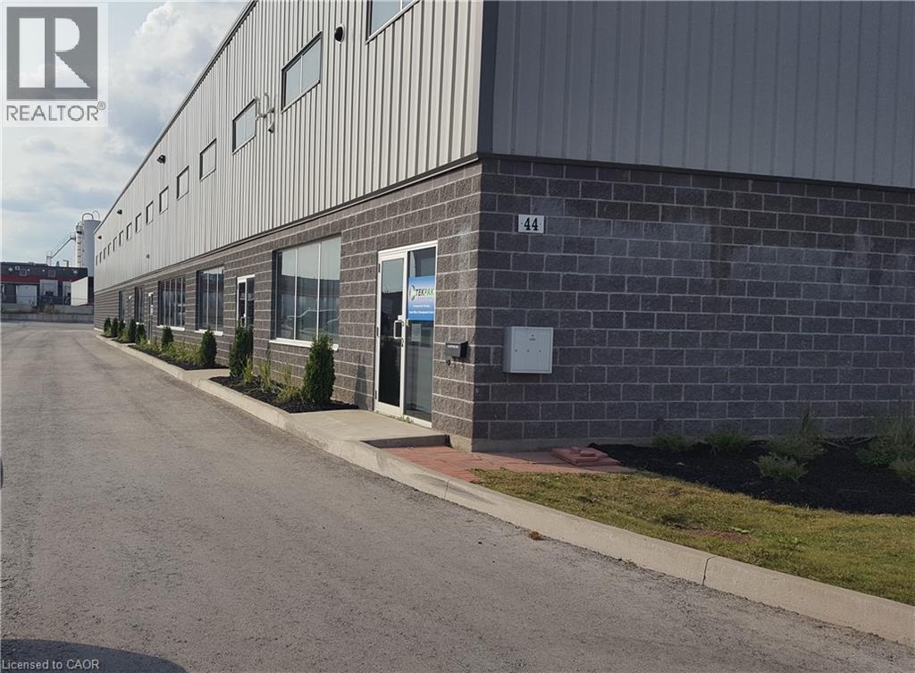 Commercial property featuring a dark brick facade and corrugated metal siding - 44 Ditton Drive Unit# 3, Hamilton, ON