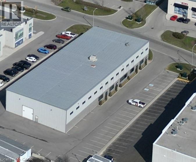 Industrial building featuring a metal roof and light-toned exterior siding - 44 Ditton Drive Unit# 3, Hamilton, ON