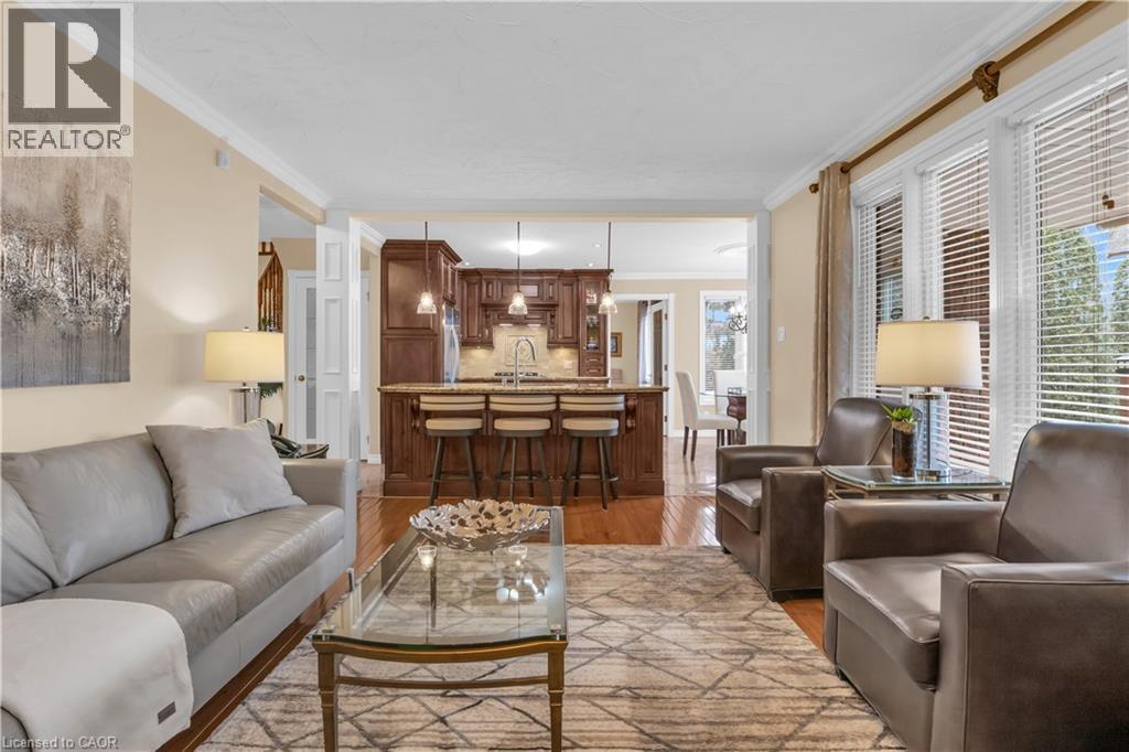 Open-concept living area with wood-finish flooring - 228 Michener Crescent, Kitchener, ON - Indoor Photo Showing Living Room