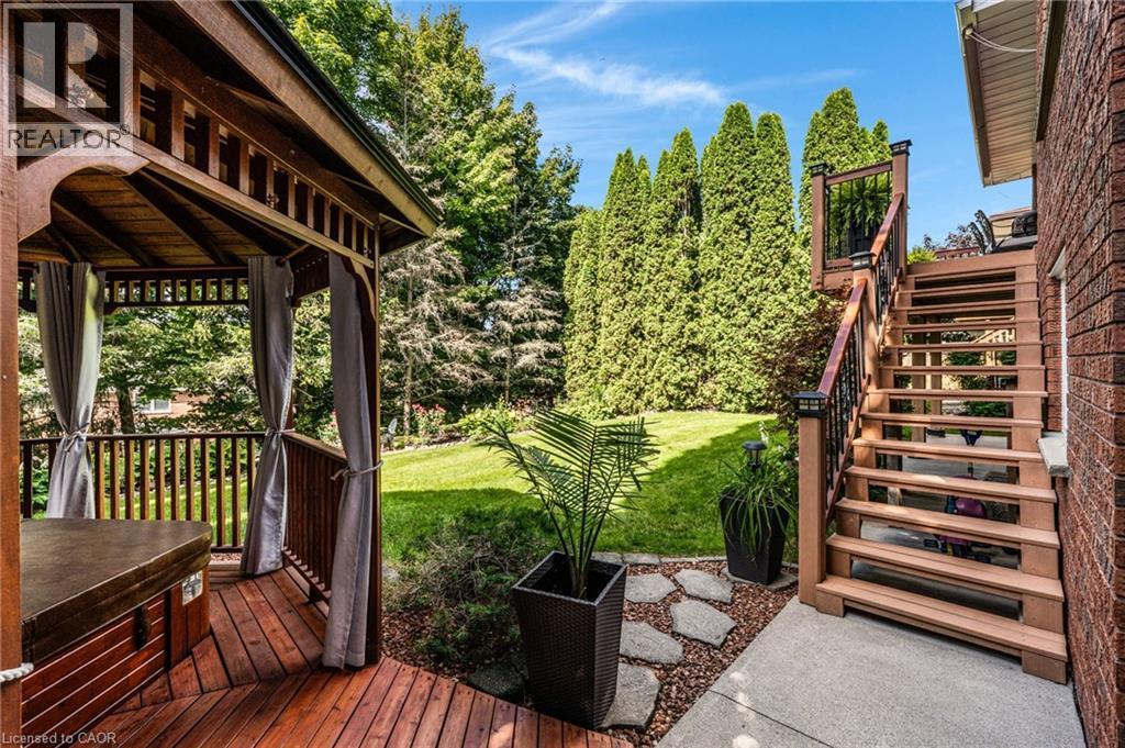 Wood-decked gazebo with privacy curtains - 228 Michener Crescent, Kitchener, ON - Outdoor With Deck Patio Veranda