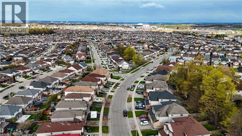 Sprawling residential development featuring a grid of paved streets and numerous detached homes - 569 Activa Avenue, Kitchener, ON - Outdoor With View