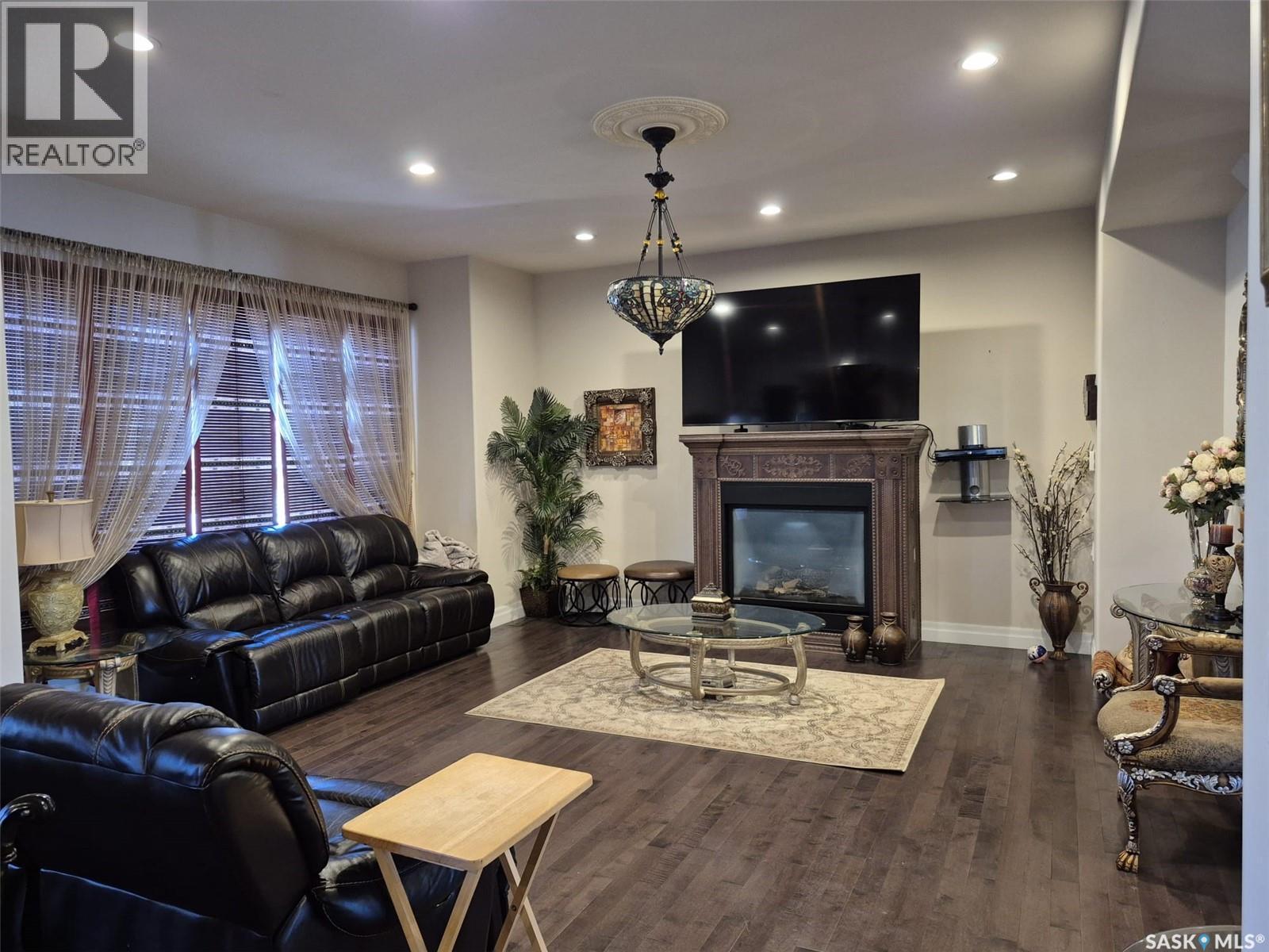 319 Roy Crescent, Saskatoon, SK - Indoor Photo Showing Living Room With Fireplace