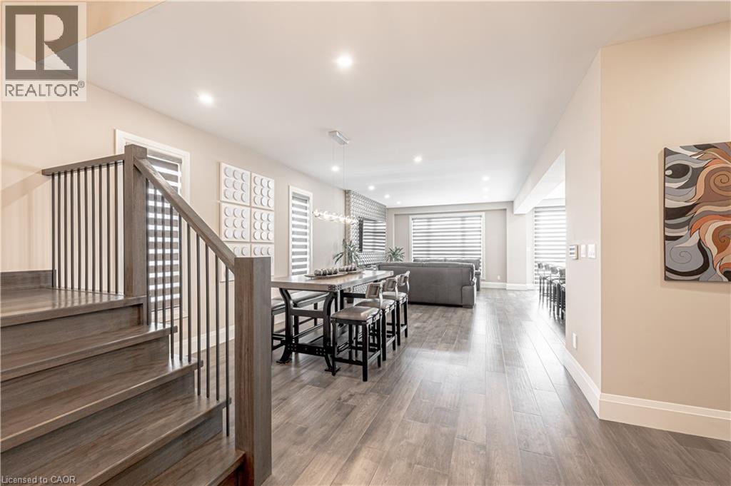Dining area with recessed lighting, stairway, baseboards, and wood finished floors - 477 Blair Creek Drive, Kitchener, ON - Indoor