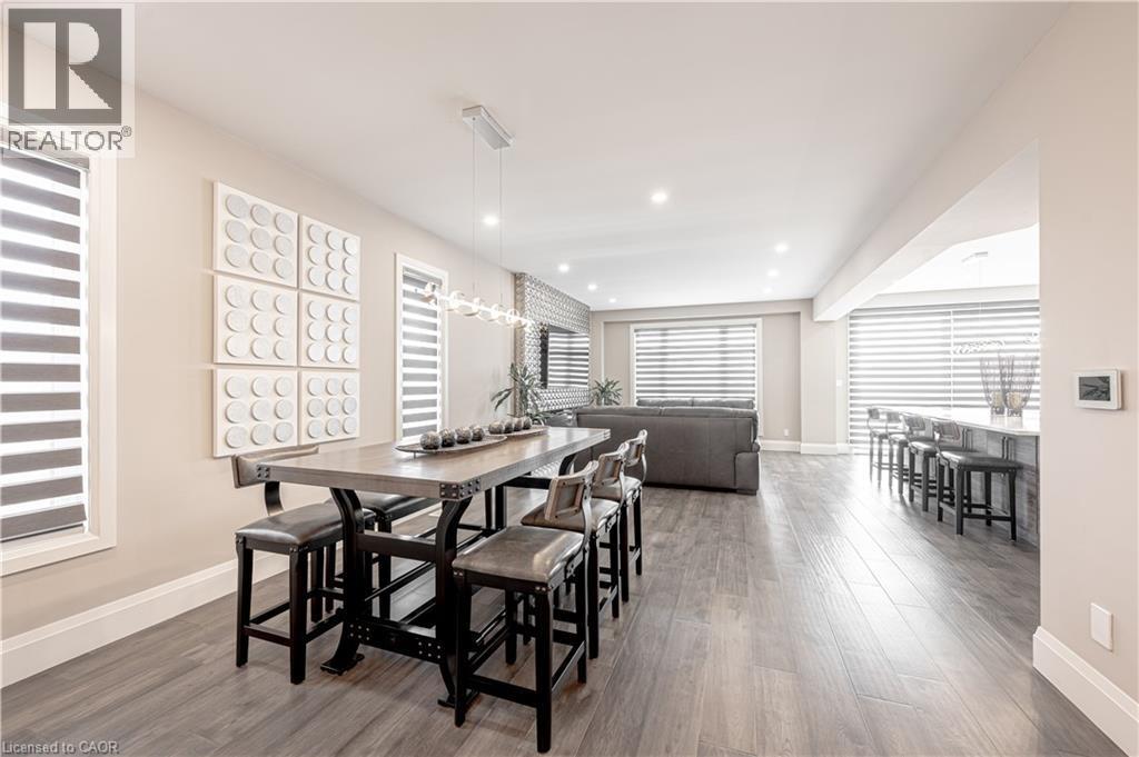 Dining space with wood finished floors, baseboards, and recessed lighting - 477 Blair Creek Drive, Kitchener, ON - Indoor Photo Showing Dining Room