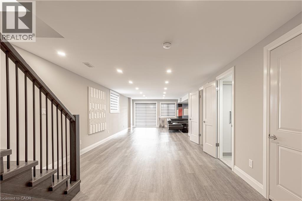Hallway featuring light wood-style floors, baseboards, stairs, and recessed lighting - 477 Blair Creek Drive, Kitchener, ON - Indoor Photo Showing Other Room