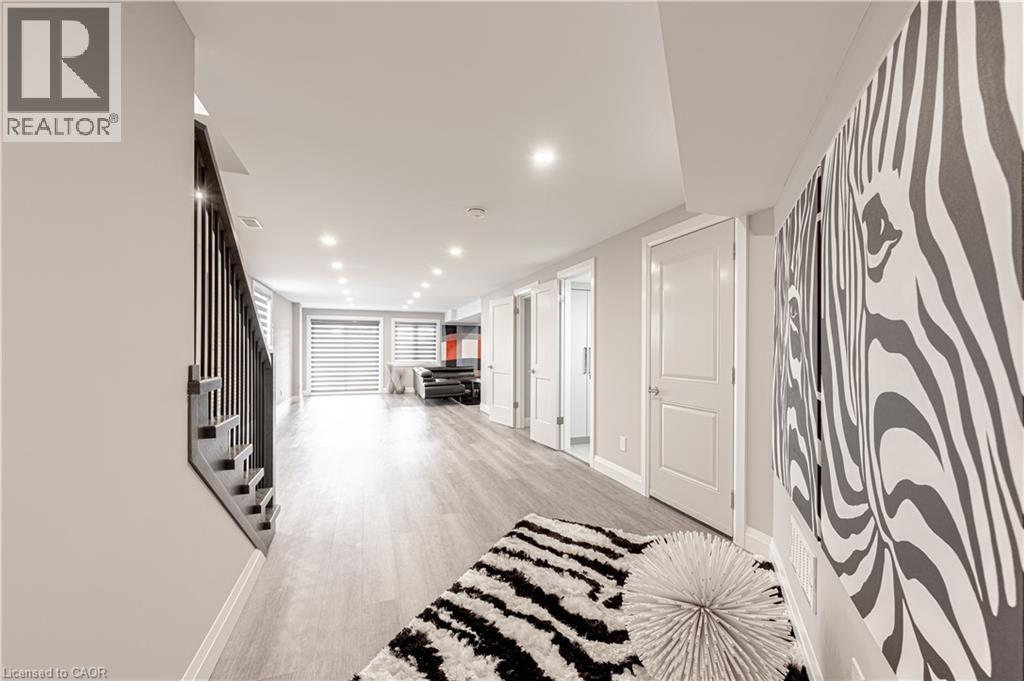 Corridor with stairway, light wood-type flooring, recessed lighting, and baseboards - 477 Blair Creek Drive, Kitchener, ON - Indoor Photo Showing Other Room
