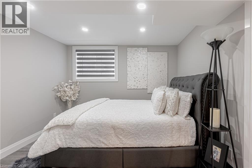 Bedroom featuring baseboards, recessed lighting, and wood finished floors - 477 Blair Creek Drive, Kitchener, ON - Indoor Photo Showing Bedroom