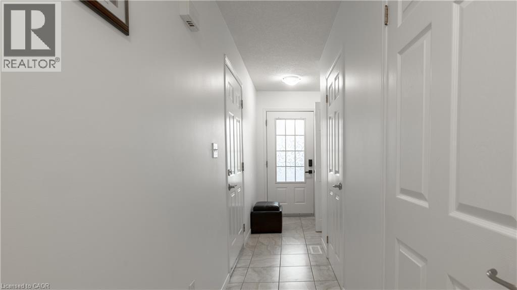 Doorway to outside featuring a textured ceiling - 85 Bankside Drive Unit# E34, Kitchener, ON - Indoor Photo Showing Other Room