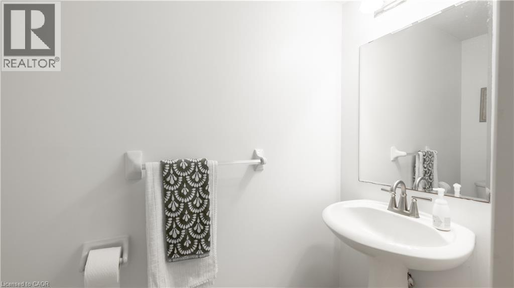 Half bath featuring a sink and toilet - 85 Bankside Drive Unit# E34, Kitchener, ON - Indoor Photo Showing Bathroom