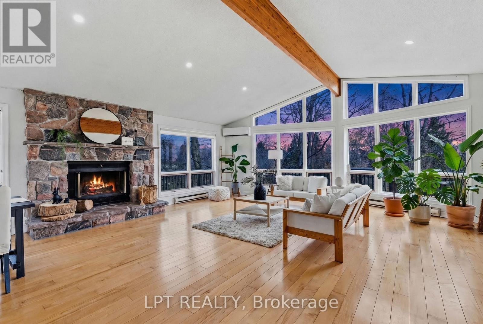Welcome Home To 50 Concession Road 2 W! - 50 Concession Rd 2 W, Tiny, ON - Indoor Photo Showing Living Room With Fireplace