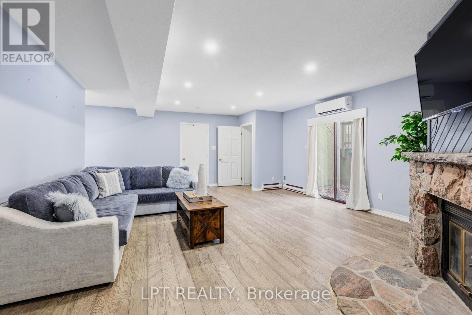 Rec Space - 50 Concession Rd 2 W, Tiny, ON - Indoor Photo Showing Living Room With Fireplace
