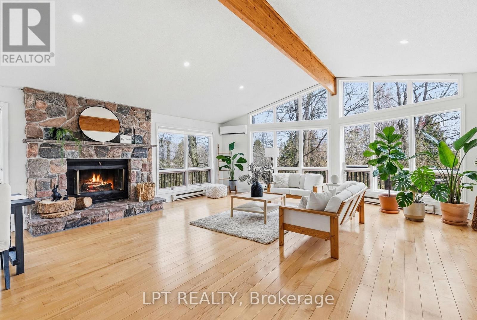 Family Room - 50 Concession Rd 2 W, Tiny, ON - Indoor Photo Showing Living Room With Fireplace