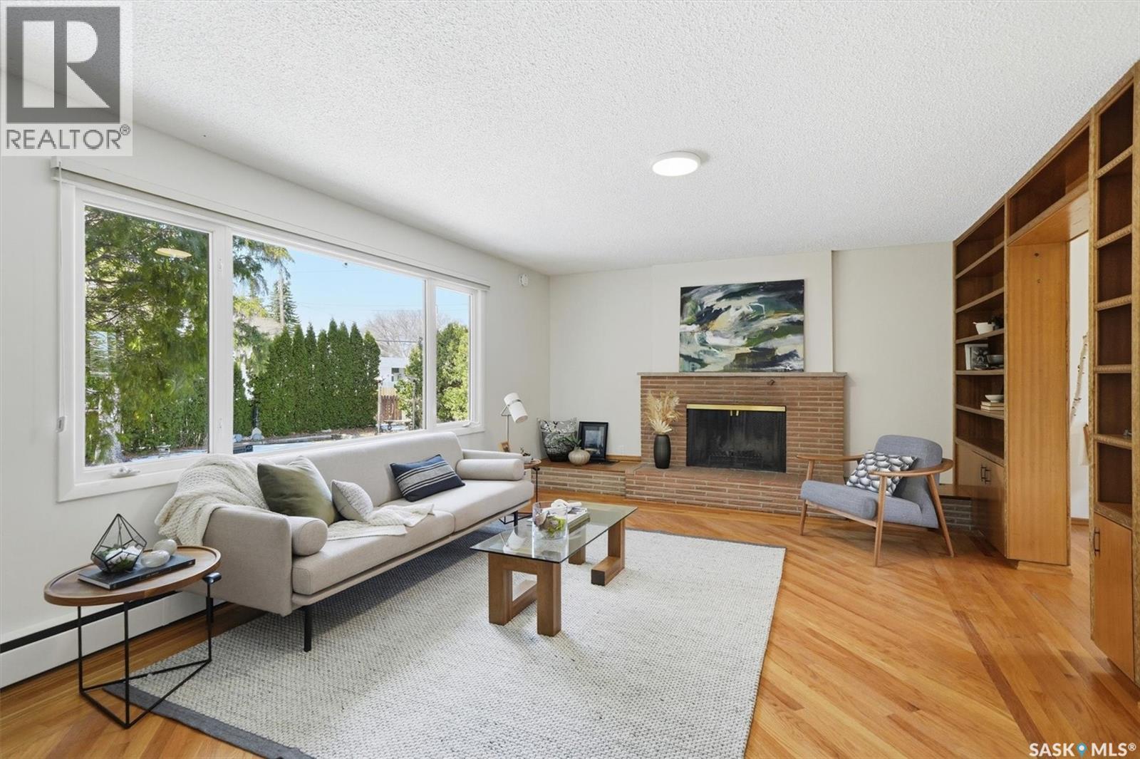 2020 Eastlake Avenue, Saskatoon, SK - Indoor Photo Showing Living Room With Fireplace