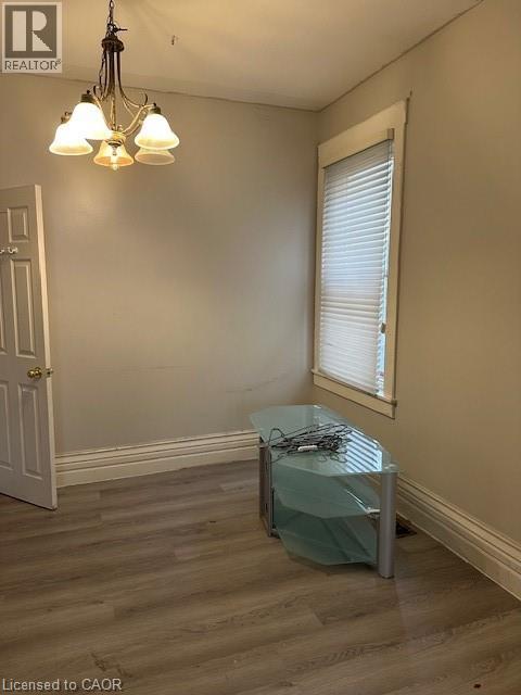Brick exterior with stone foundation and contrasting trim details - 867 Queens Avenue Unit# A, London, ON - Outdoor With Facade
