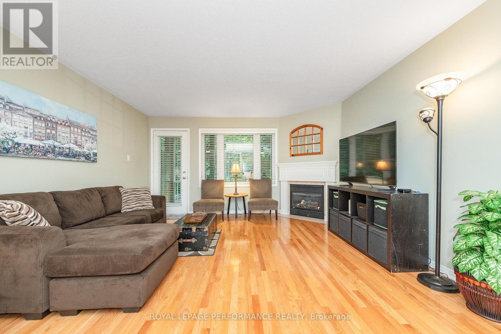 111 Steele Park Private, Ottawa, ON - Indoor Photo Showing Living Room With Fireplace
