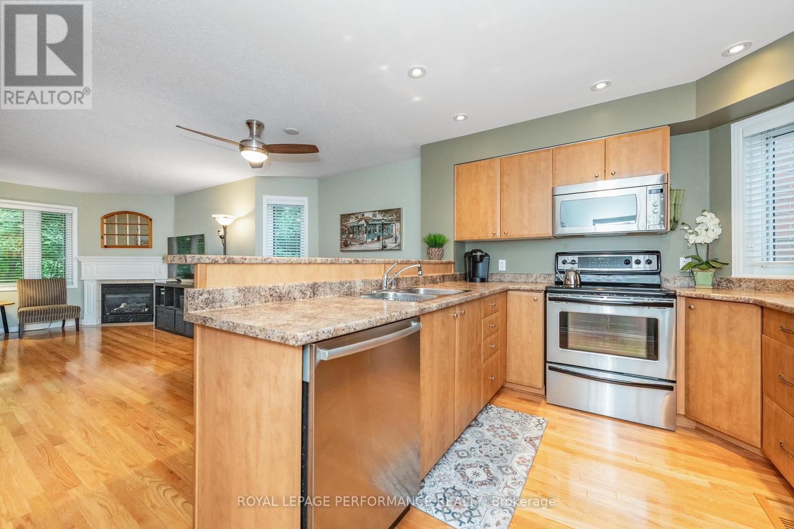 111 Steele Park Private, Ottawa, ON - Indoor Photo Showing Kitchen With Fireplace With Stainless Steel Kitchen With Double Sink