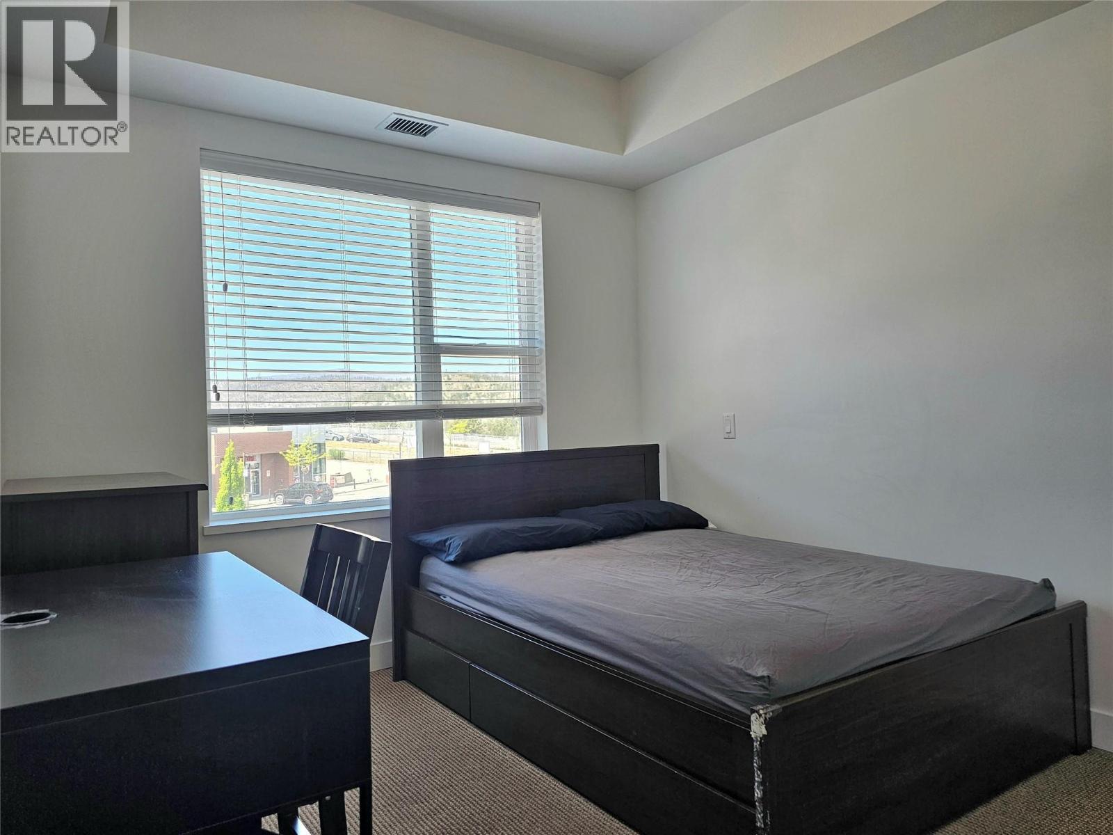 Large bedroom - 985 Academy Way Unit# 310, Kelowna, BC - Indoor Photo Showing Bedroom