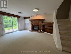 Family room with natural gas fireplace and walkout - 