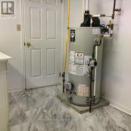 laundry room with NG water heater - 