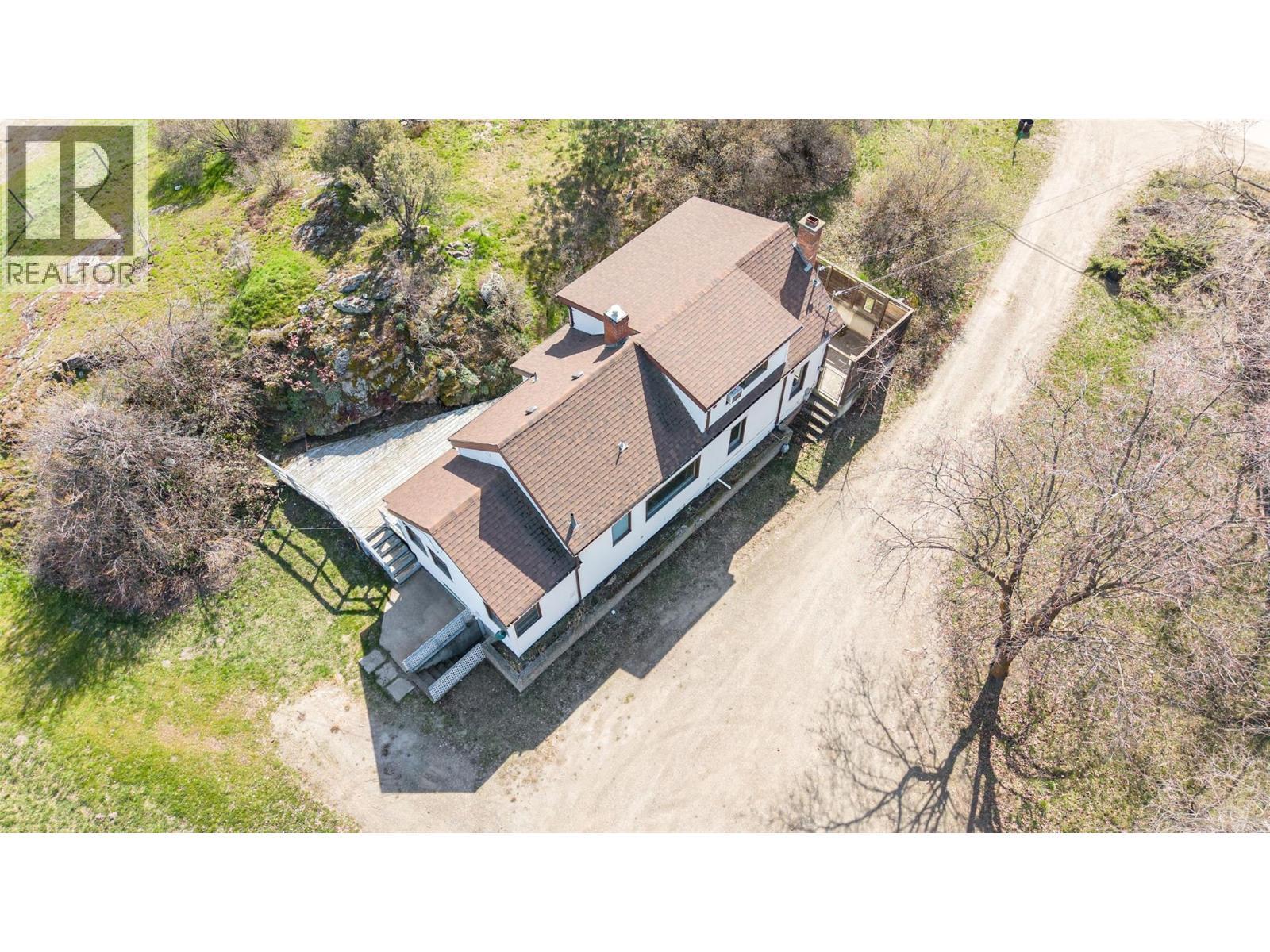 Aerial of 1942 farmhouse - 10091 6 Highway, Coldstream, BC