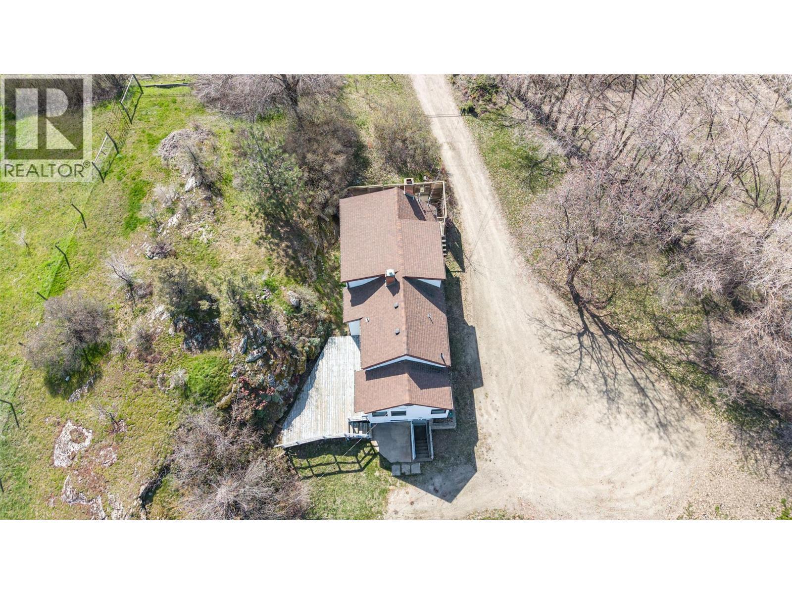 Aerial of 1942 farmhouse - 10091 6 Highway, Coldstream, BC