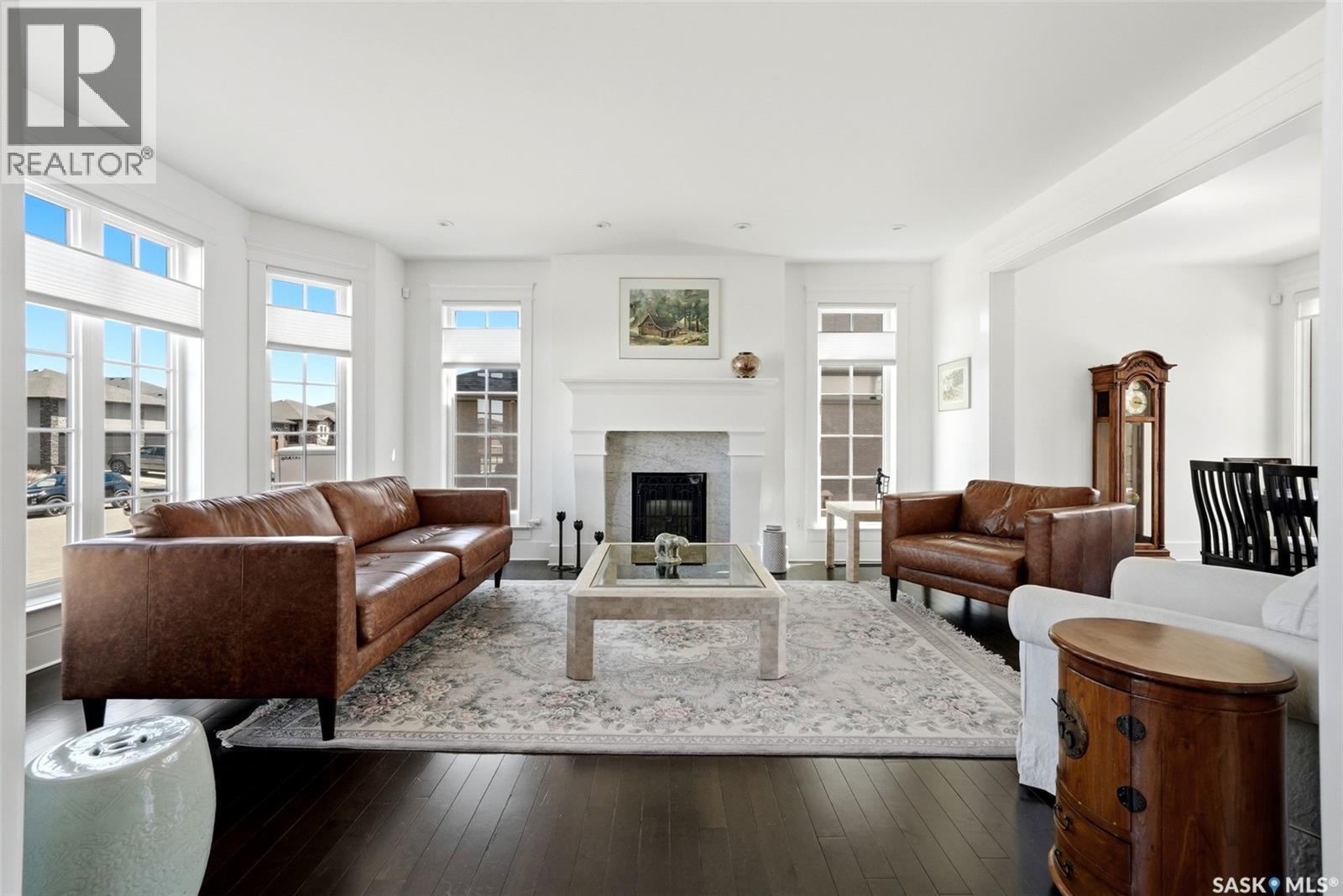 6105 Little Pine Loop, Regina, SK - Indoor Photo Showing Living Room With Fireplace