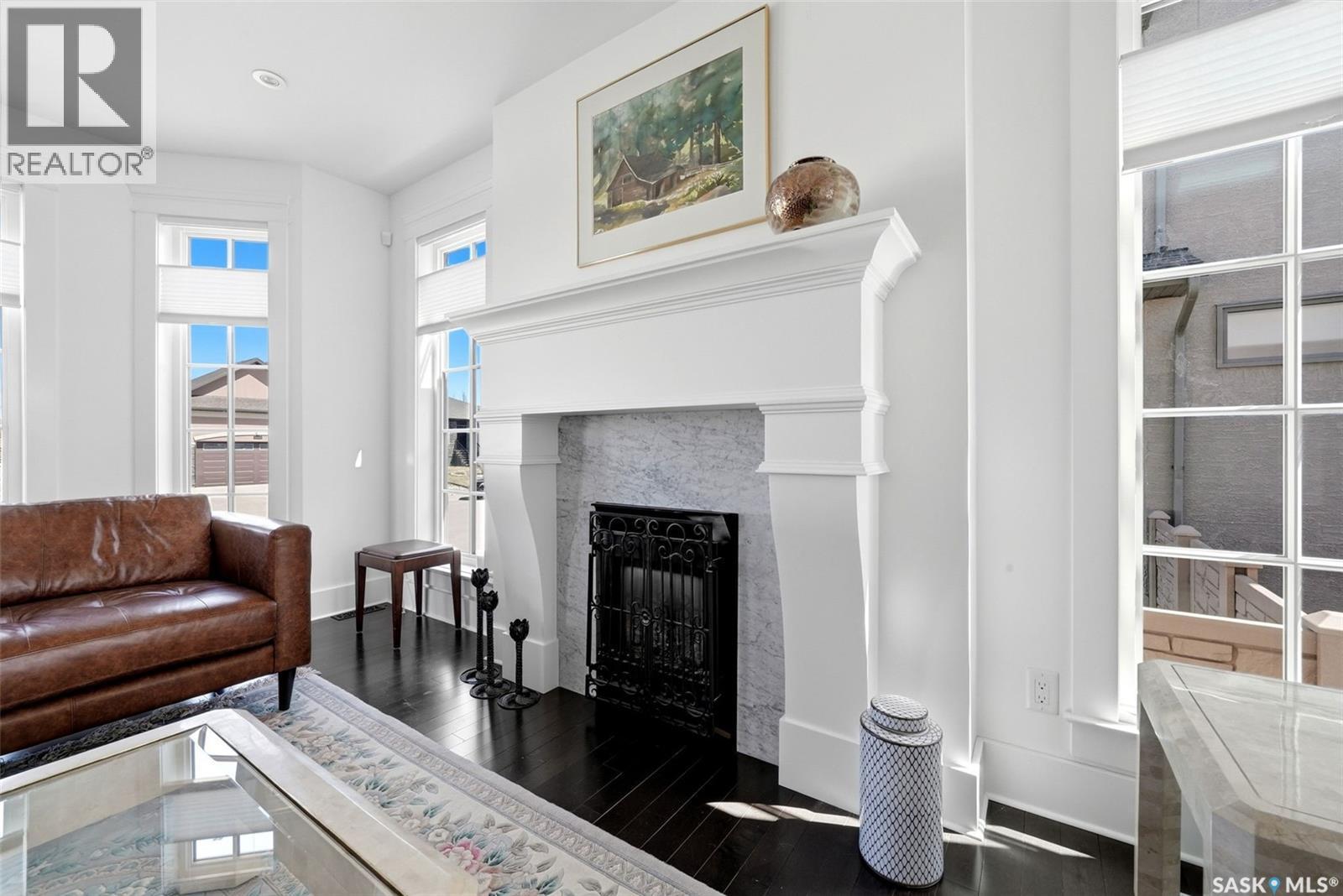 6105 Little Pine Loop, Regina, SK - Indoor Photo Showing Living Room With Fireplace