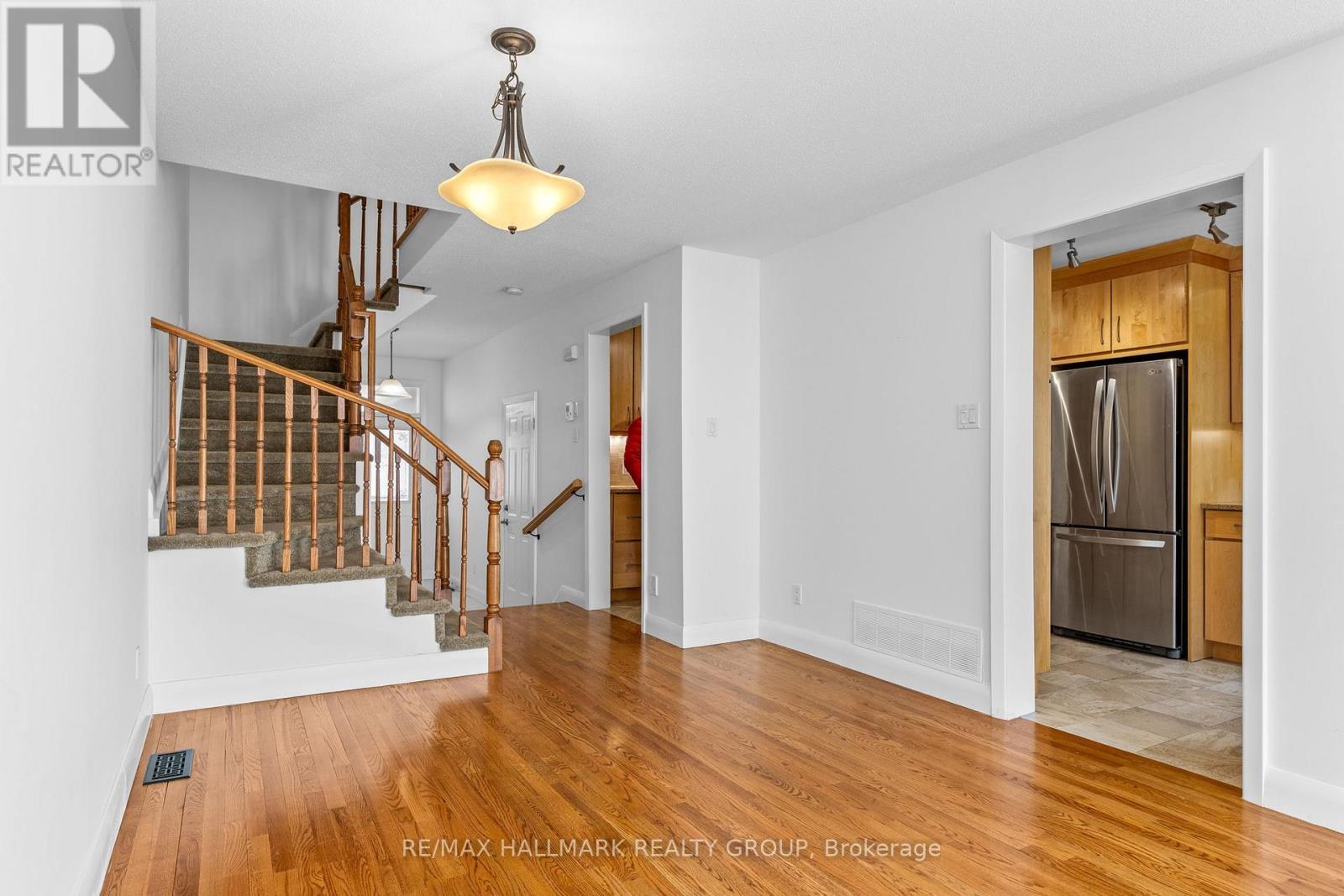 Main floor living and stair view w/ kitchen access - 988 Lucille Way, Ottawa, ON - Indoor Photo Showing Other Room