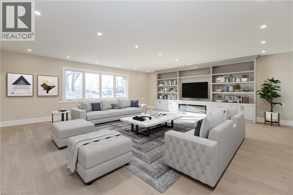 Living room featuring light wood finished floors, recessed lighting, and built in features - 1105 Main Street E, Cambridge, ON - Indoor Photo Showing Living Room