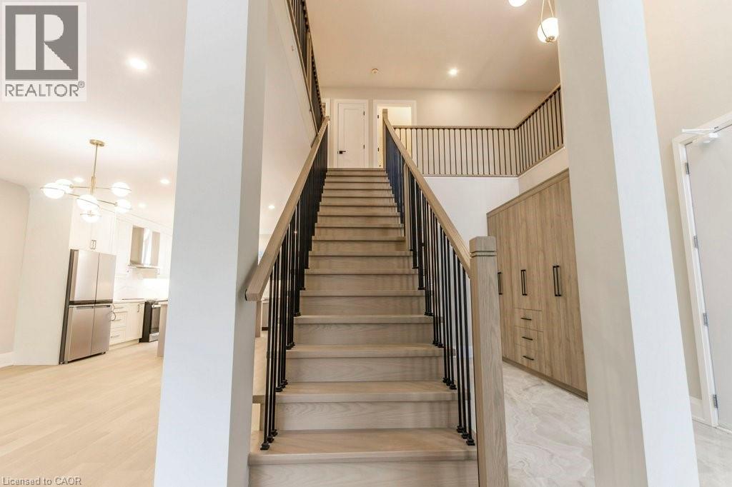 Stairs featuring hanging lights - 1105 Main Street E, Cambridge, ON - Indoor Photo Showing Other Room