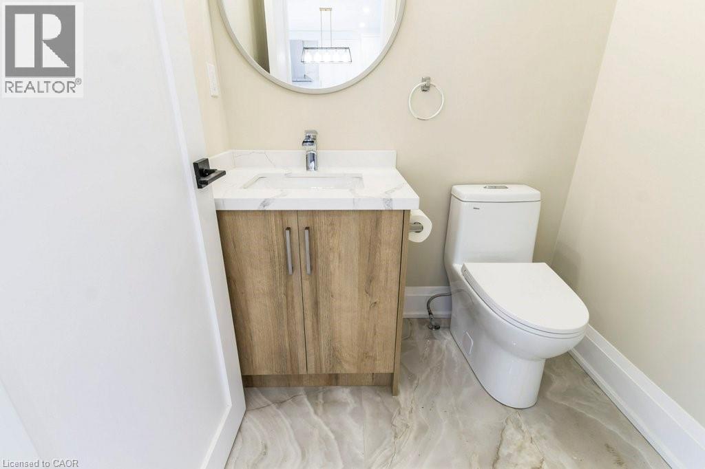 Half bath featuring vanity and toilet - 1105 Main Street E, Cambridge, ON - Indoor Photo Showing Bathroom