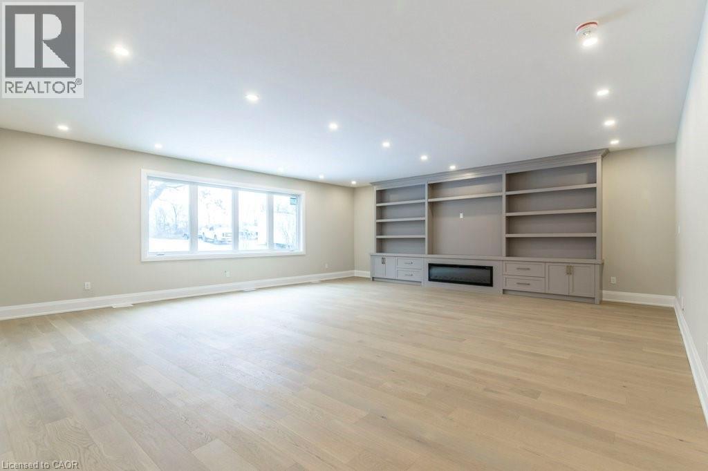 Unfurnished living room with light wood-type flooring and recessed lighting - 1105 Main Street E, Cambridge, ON - Indoor Photo Showing Other Room