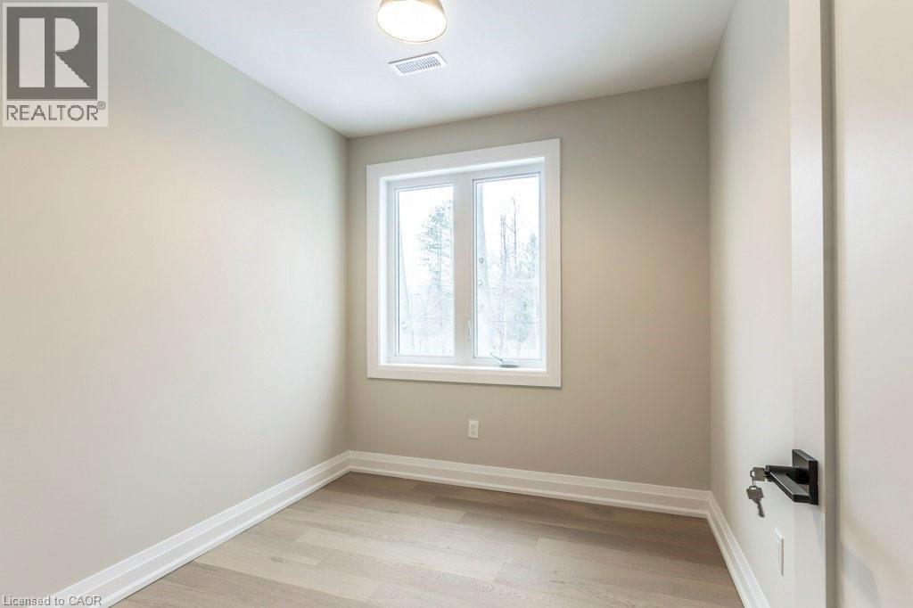 Empty room with light wood-style floors and baseboards - 1105 Main Street E, Cambridge, ON - Indoor Photo Showing Other Room