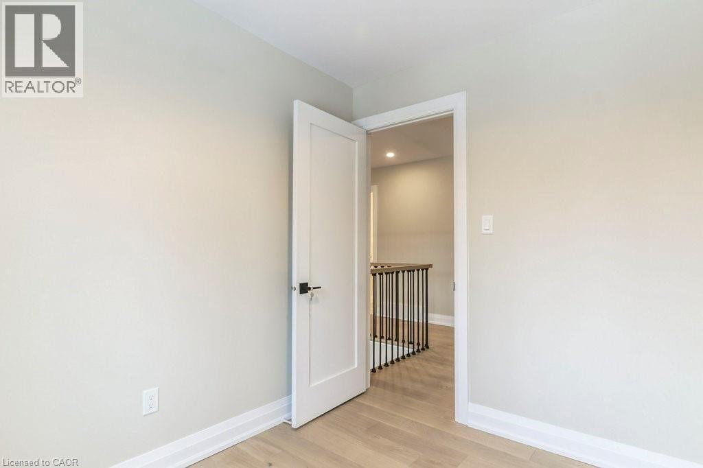 Empty room with light wood-type flooring and recessed lighting - 1105 Main Street E, Cambridge, ON - Indoor Photo Showing Other Room