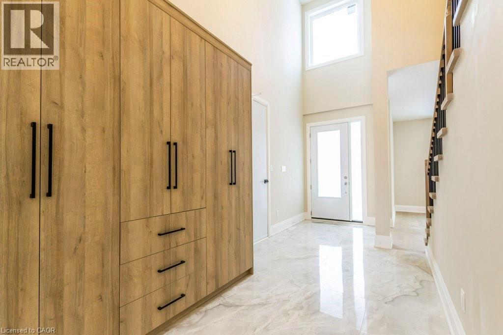 Entrance foyer featuring a high ceiling and light marble finish floors - 1105 Main Street E, Cambridge, ON - Indoor Photo Showing Other Room