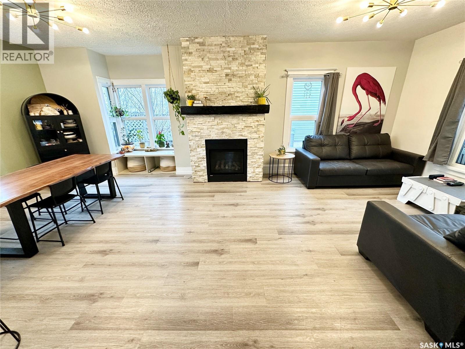 416 3Rd Street Se, Weyburn, SK - Indoor Photo Showing Living Room With Fireplace