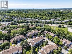 Aerial perspective showcasing a residential community with tree-lined streets -