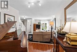Warm wood-finish flooring extending throughout the space -