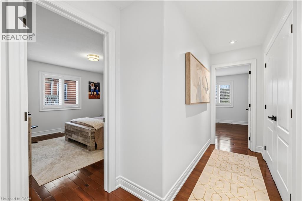 Hallway featuring rich wood-finish flooring, white trim, and recessed lighting - 199 Hunter Street W, Hamilton, ON - Indoor Photo Showing Other Room