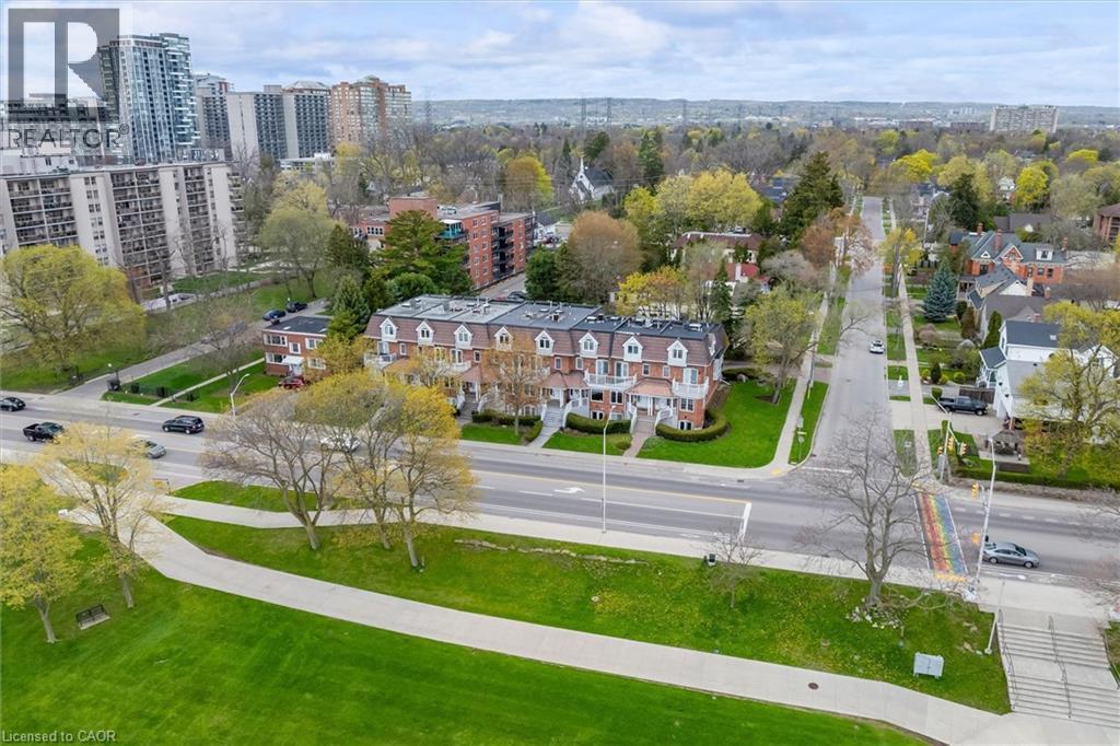 Townhouse row featuring brick facades and dormer windows - 1389 Lakeshore Road, Burlington, ON - Outdoor With View