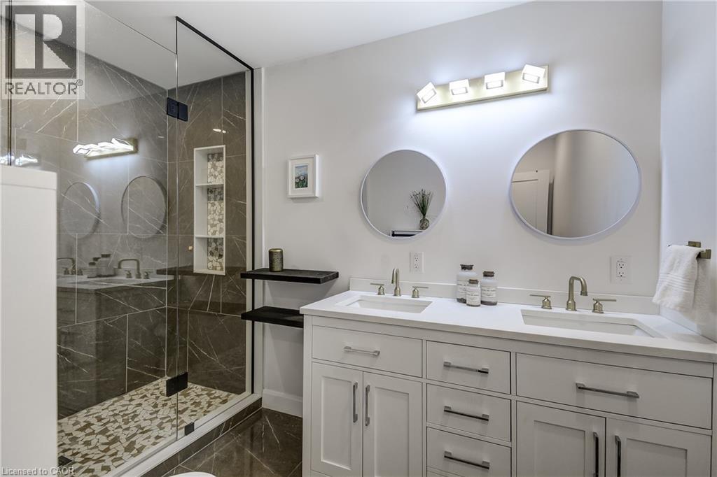 Contemporary bathroom featuring a spacious glass-enclosed shower with tiled walls and a mosaic floor - 29 Wiltshire Place, Ancaster, ON - Indoor Photo Showing Bathroom