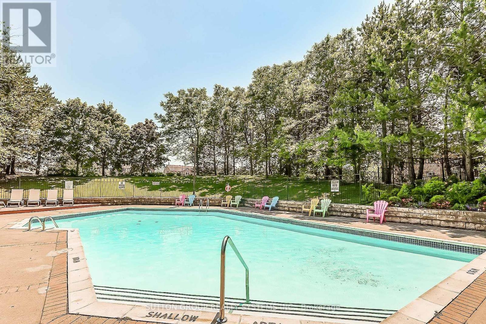 802 - 20 Cherrytree Drive, Brampton, ON - Outdoor With In Ground Pool With Backyard