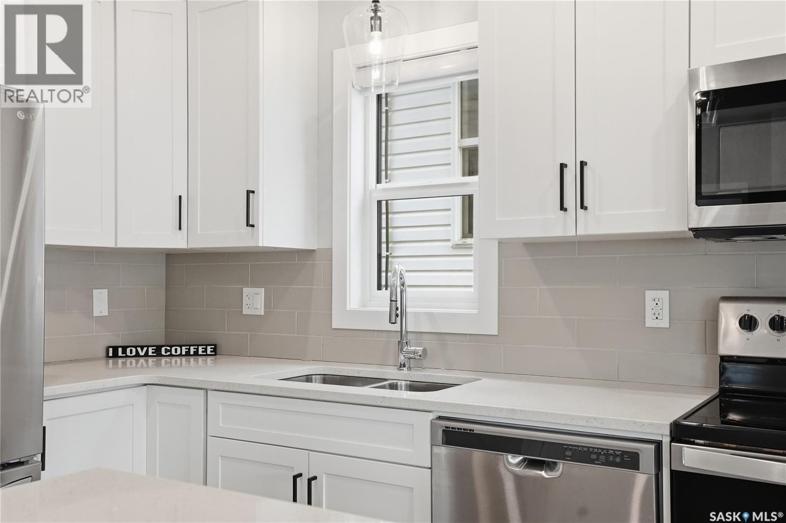 246 Aniskotaw Manor, Saskatoon, SK - Indoor Photo Showing Kitchen With Double Sink