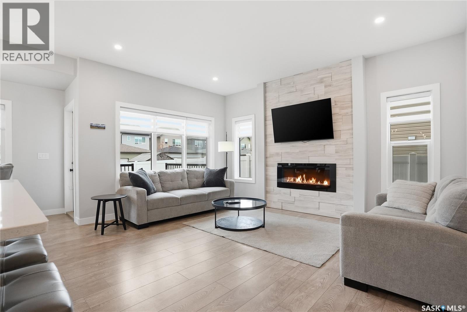 246 Aniskotaw Manor, Saskatoon, SK - Indoor Photo Showing Living Room With Fireplace